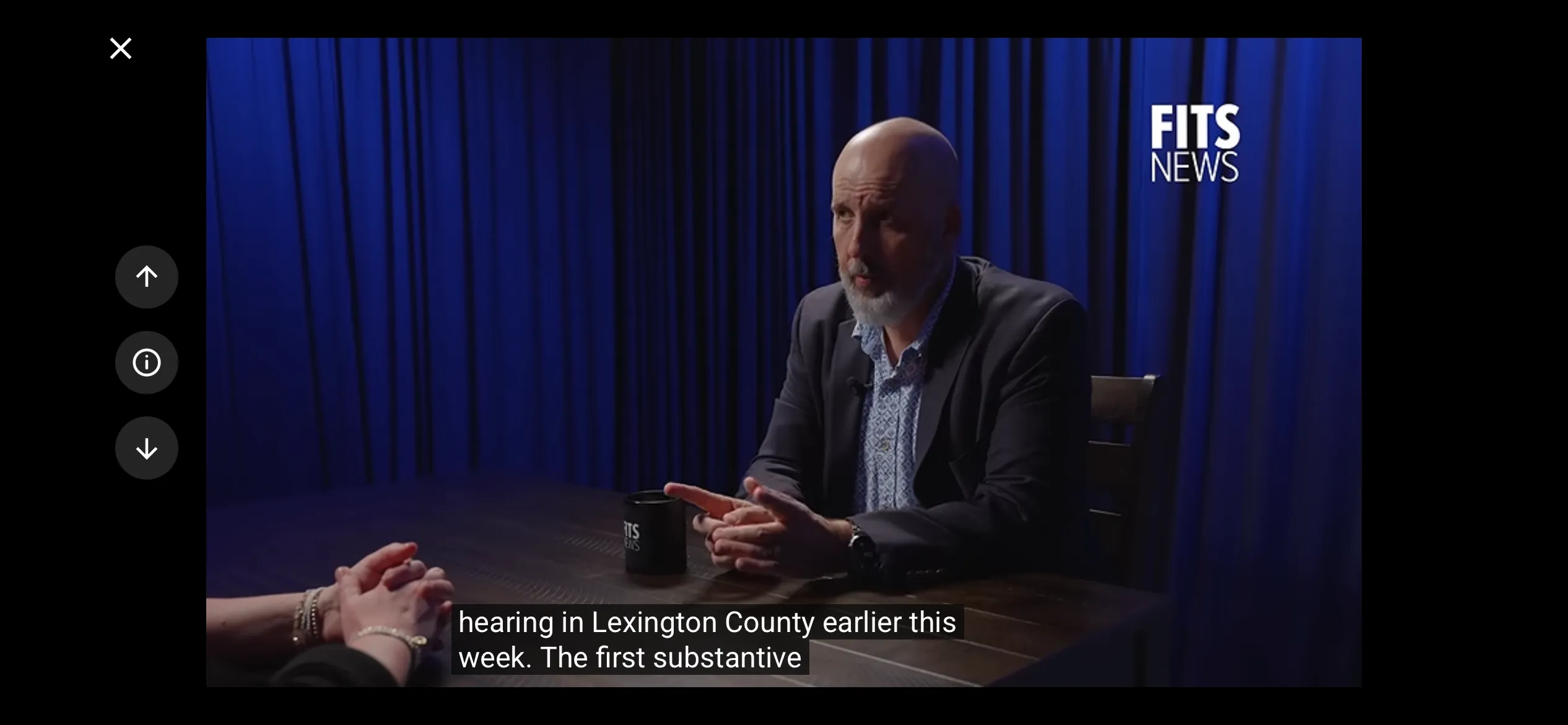 FITSNews video playing full screen in landscape, with captions